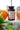 KI-generierte Abbildung (beispielhaft): Yes Vegan Sun Vitamins D3 + K2 180 Kapseln zwischen Orangen am Fenster